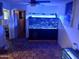 Unique living area with a large aquarium and patterned tile flooring at 5539 N 31St Ln, Phoenix, AZ 85017
