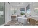 Spa-like bathroom with a freestanding tub, modern fixtures, and double sink vanity at 6449 E Paradise Ln, Scottsdale, AZ 85254