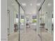 Hallway view of luxurious bathroom with soaking tub, stylish vanities, and a contemporary design at 6449 E Paradise Ln, Scottsdale, AZ 85254