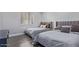 Comfortable bedroom with two beds, soft lighting, and modern design at 6449 E Paradise Ln, Scottsdale, AZ 85254