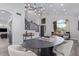 Dining area features a modern table, chairs and views of the staircase at 6449 E Paradise Ln, Scottsdale, AZ 85254