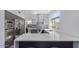 Modern kitchen features stainless appliances, a spacious island, and natural light from the window at 6449 E Paradise Ln, Scottsdale, AZ 85254