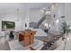 Spacious living room featuring a foosball table, dining area, and staircase at 6449 E Paradise Ln, Scottsdale, AZ 85254