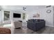 Spacious living room with modern gray sofas, wall-mounted TV, and neutral décor at 6449 E Paradise Ln, Scottsdale, AZ 85254