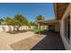 Expansive backyard features a covered patio, lush lawn, mature trees, and privacy fencing at 7618 N Via Del Paraiso --, Scottsdale, AZ 85258