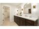 Bathroom with a double vanity, quartz countertop, and gold fixtures at 7618 N Via Del Paraiso --, Scottsdale, AZ 85258