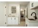 Charming laundry area with modern fixtures, white cabinets, and access to other rooms at 7618 N Via Del Paraiso --, Scottsdale, AZ 85258