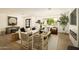 Bright and open living room featuring hardwood floors, large windows, and a comfortable seating arrangement at 7618 N Via Del Paraiso --, Scottsdale, AZ 85258