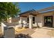 Charming outdoor patio with pergola, brick pavers, and comfortable seating for enjoying the backyard views at 7618 N Via Del Paraiso --, Scottsdale, AZ 85258