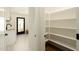 Pantry with white shelving, offering ample storage off of a small kitchenette at 7618 N Via Del Paraiso --, Scottsdale, AZ 85258