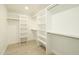 A white walk-in closet with shelving and hanging rods, providing ample storage space at 7618 N Via Del Paraiso --, Scottsdale, AZ 85258