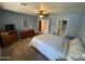 Comfortable bedroom with a ceiling fan, carpeted floors, and plenty of natural light at 8255 E Kiva Ave # 430, Mesa, AZ 85209