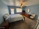 Bedroom featuring carpeted floors, ceiling fan, and natural light at 8255 E Kiva Ave # 430, Mesa, AZ 85209