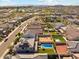 In an established community, a two-story home features solar panels and a modern pool at 8754 W San Juan Ave, Glendale, AZ 85305