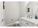 Powder room with white vanity and stylish decor at 8754 W San Juan Ave, Glendale, AZ 85305