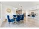 Open concept living space with formal dining room, kitchen, and breakfast bar at 8754 W San Juan Ave, Glendale, AZ 85305