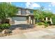 Charming two-story home with a brick driveway and xeriscaped front yard at 8754 W San Juan Ave, Glendale, AZ 85305