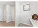 Hallway showcasing neutral walls, tiled floor, and decorative wall art at 8754 W San Juan Ave, Glendale, AZ 85305