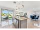 Open kitchen featuring stainless steel appliances, granite counters, and backyard views at 8754 W San Juan Ave, Glendale, AZ 85305
