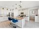 Bright kitchen features granite counters, an island with seating, stainless steel appliances, and pendant lighting at 8754 W San Juan Ave, Glendale, AZ 85305