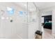 Bright shower with a glass enclosure and white tiled walls at 8754 W San Juan Ave, Glendale, AZ 85305