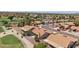 Gorgeous aerial view of homes backing to a golf course in an active adult community with mature landscaping at 9263 W Oraibi Dr, Peoria, AZ 85382
