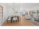 Spacious open living and dining area with hardwood floors and plenty of natural light at 9263 W Oraibi Dr, Peoria, AZ 85382