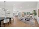 Open concept living space with a dining area, hardwood floors and plenty of natural light at 9263 W Oraibi Dr, Peoria, AZ 85382