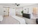 Spacious main bedroom featuring a sliding barn door and ample natural light at 9263 W Oraibi Dr, Peoria, AZ 85382