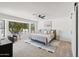 Serene main bedroom featuring large windows, a ceiling fan, and calming decor at 9263 W Oraibi Dr, Peoria, AZ 85382