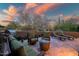 Spacious back patio with comfortable seating, a grill, and picturesque desert views for outdoor living at 9270 E Thompson Peak Pkwy # 347, Scottsdale, AZ 85255