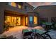 Inviting back patio with comfortable seating, tiled flooring, and outdoor lighting for evening relaxation at 9270 E Thompson Peak Pkwy # 347, Scottsdale, AZ 85255