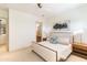 Bright bedroom featuring neutral color scheme, ensuite bathroom access, and decorative artwork at 9270 E Thompson Peak Pkwy # 347, Scottsdale, AZ 85255