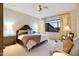 This bedroom has a ceiling fan, natural lighting, and stylish furniture with carpet at 9270 E Thompson Peak Pkwy # 347, Scottsdale, AZ 85255