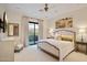 Relax in this bedroom featuring decorative lighting, carpet, and access to a private balcony at 9270 E Thompson Peak Pkwy # 347, Scottsdale, AZ 85255