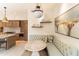 Stylish breakfast nook with cushioned bench seating and modern lighting adjacent to the open kitchen at 9270 E Thompson Peak Pkwy # 347, Scottsdale, AZ 85255