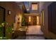 Private courtyard with fountain, seating, and view of the home's front door and windows at 9270 E Thompson Peak Pkwy # 347, Scottsdale, AZ 85255