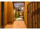 Elegant entrance through a decorative gate leading to the front door of this stylish home at 9270 E Thompson Peak Pkwy # 347, Scottsdale, AZ 85255