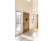 Light and bright entryway featuring a solid wood front door and a view of the front courtyard at 9270 E Thompson Peak Pkwy # 347, Scottsdale, AZ 85255