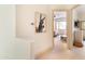 Hallway leading to the bedroom features neutral walls, carpet and stylish décor at 9270 E Thompson Peak Pkwy # 347, Scottsdale, AZ 85255