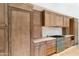 Well-equipped kitchen with custom wood cabinets, stainless steel appliances, and a stylish gas range at 9270 E Thompson Peak Pkwy # 347, Scottsdale, AZ 85255