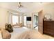Bright and airy main bedroom featuring a bay window, stylish furnishings, and seamless patio access at 9270 E Thompson Peak Pkwy # 347, Scottsdale, AZ 85255