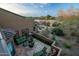 Cozy outdoor patio with desert landscape views and mountain backdrop at 9270 E Thompson Peak Pkwy # 347, Scottsdale, AZ 85255
