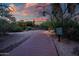 Scenic walking path through lush desert landscaping under a beautiful sunset sky at 9270 E Thompson Peak Pkwy # 347, Scottsdale, AZ 85255