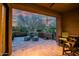 Inviting covered patio with tile flooring and comfortable lounge chairs offers serene outdoor living space at 9270 E Thompson Peak Pkwy # 347, Scottsdale, AZ 85255