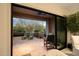Inviting covered patio with tile flooring and comfortable lounge chairs offers serene outdoor living space at 9270 E Thompson Peak Pkwy # 347, Scottsdale, AZ 85255