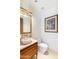 Stylish powder room featuring designer fixtures, marble sink, and decorative wall art at 9270 E Thompson Peak Pkwy # 347, Scottsdale, AZ 85255