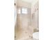 This updated shower features a glass door, bench, and designer tile with natural lighting at 9270 E Thompson Peak Pkwy # 347, Scottsdale, AZ 85255
