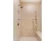Tiled shower with bronze fixtures at 9270 E Thompson Peak Pkwy # 347, Scottsdale, AZ 85255