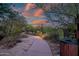 Tranquil desert walking path illuminated by soft lighting at dusk at 9270 E Thompson Peak Pkwy # 347, Scottsdale, AZ 85255